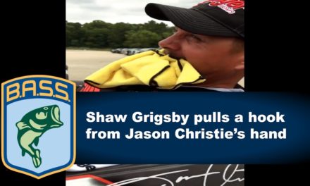 Bassmaster – Shaw Grigsby removes hook from Jason Christie’s hand